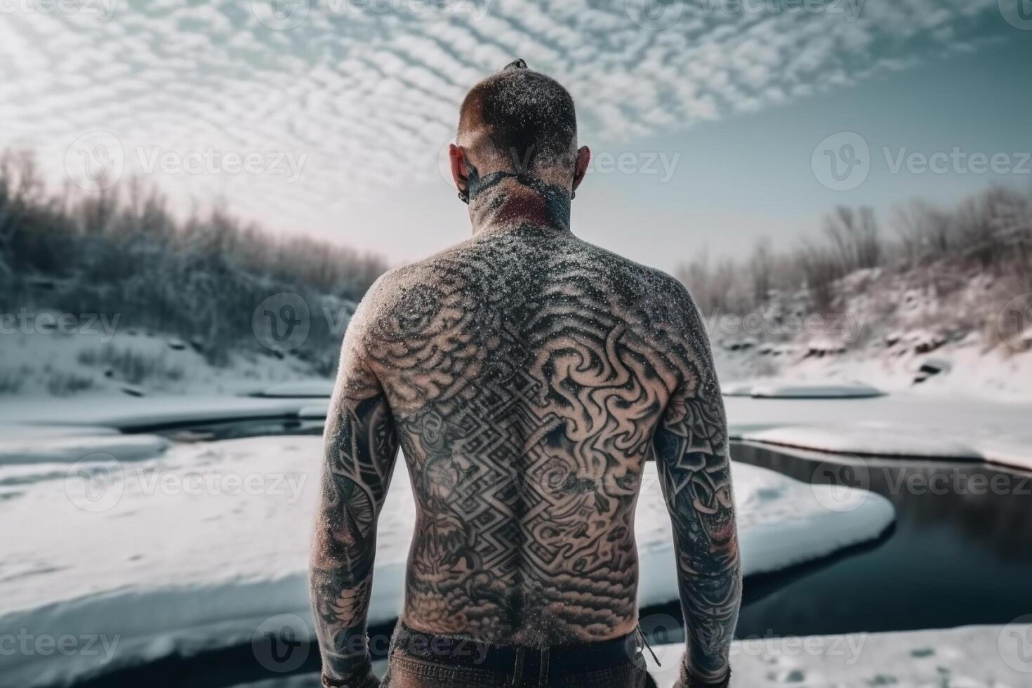 Icelandic man with his back covered in tattoos outside in frozen winter. photo