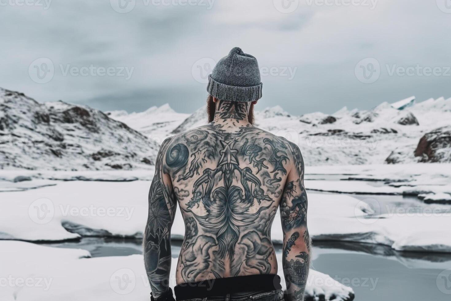 Icelandic man with his back covered in tattoos outside in frozen winter. photo