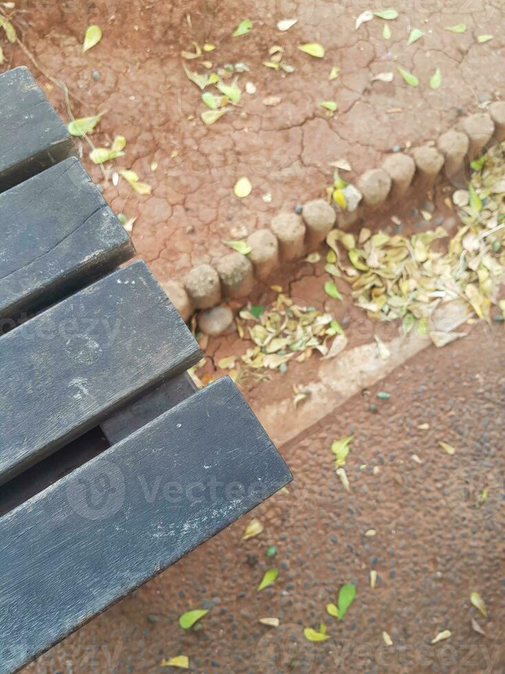 Negative Space, a copy space of the edge of a wooden chair that is starting to turn black. photo