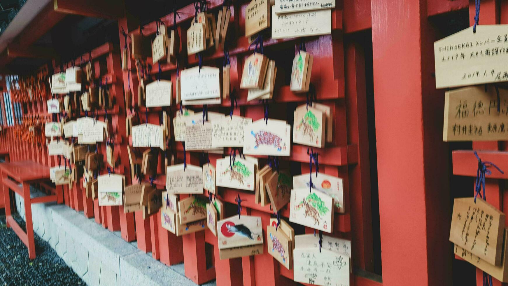 Kyoto, Japan in April 2019. Wish and prayer board or commonly called Ema. Ema are small wooden plaques, common in Japan, on which Shinto and Buddhist devotees write prayers photo