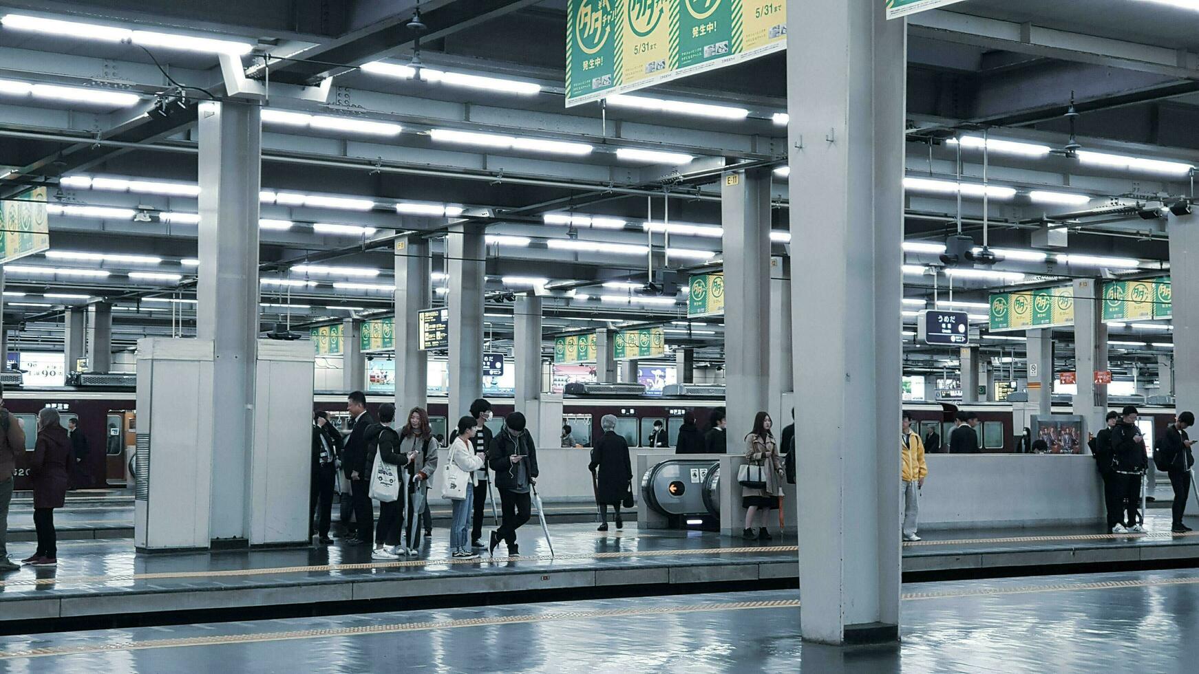 Osaka, Japan in April 2019. The atmosphere of the Umeda Station platform is quite crowded. photo
