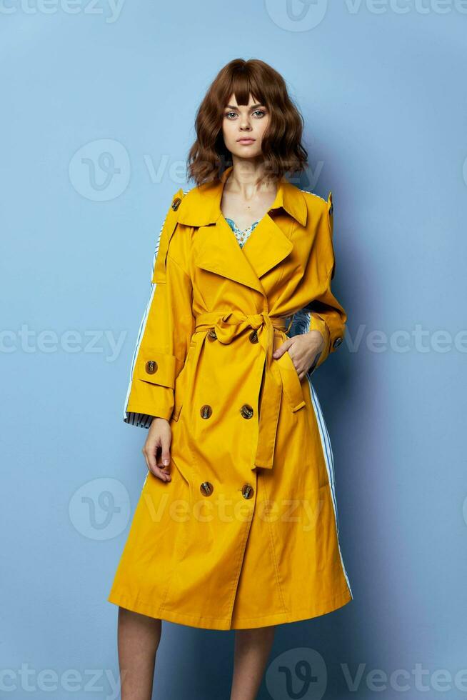 Brunette, woman Looking ahead lifestyle with short hair yellow coat photo