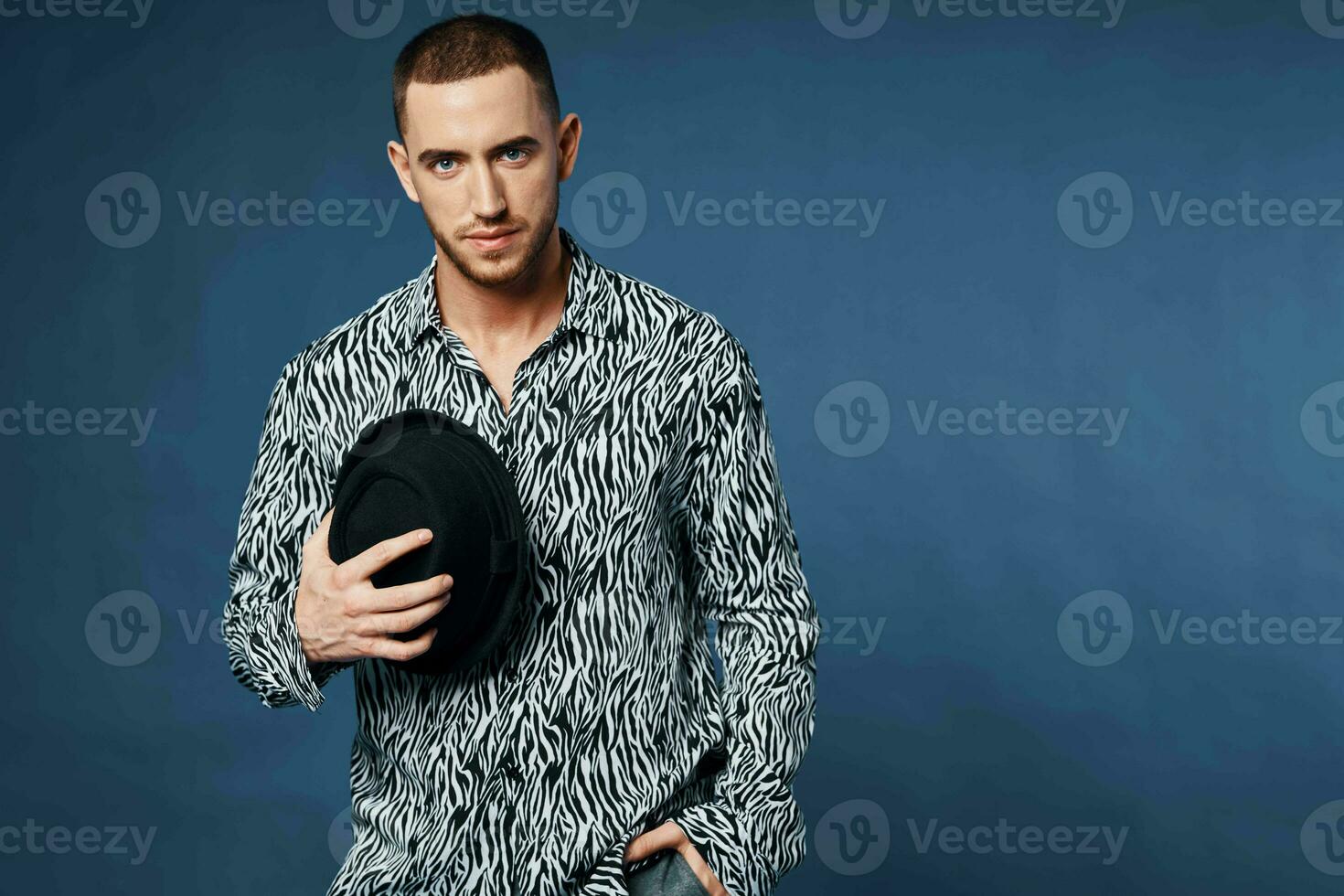 man in shirt wearing black hat posing fashion elegant style photo