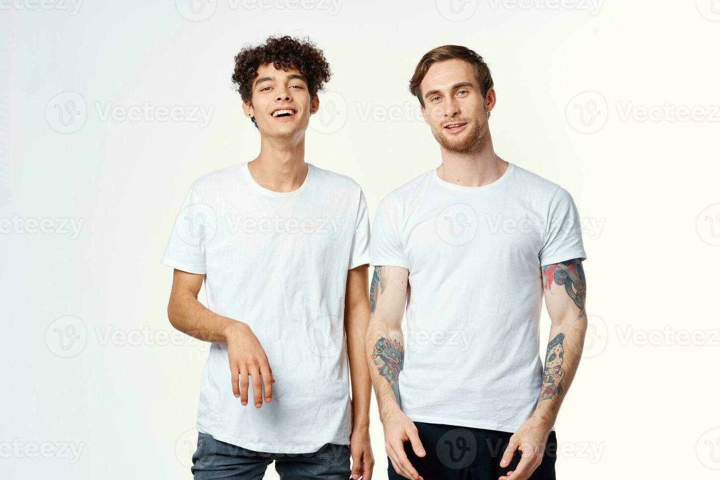 two men are standing next to clean t-shirts emotions communication studio photo