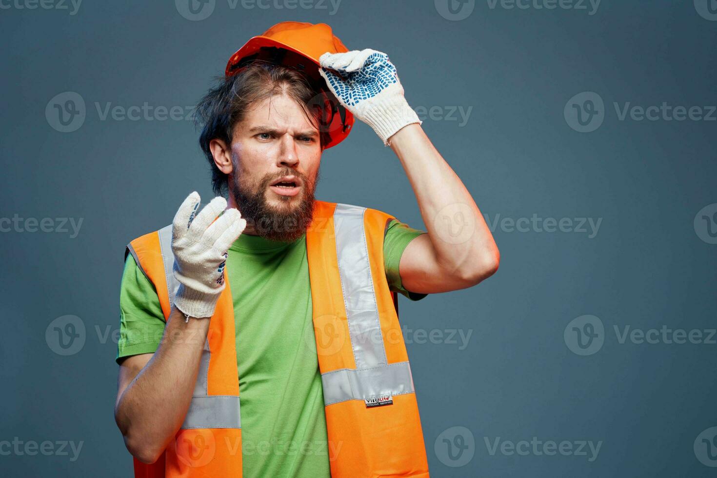 A bearded man in a builder in the form of emotions of a security Professional photo