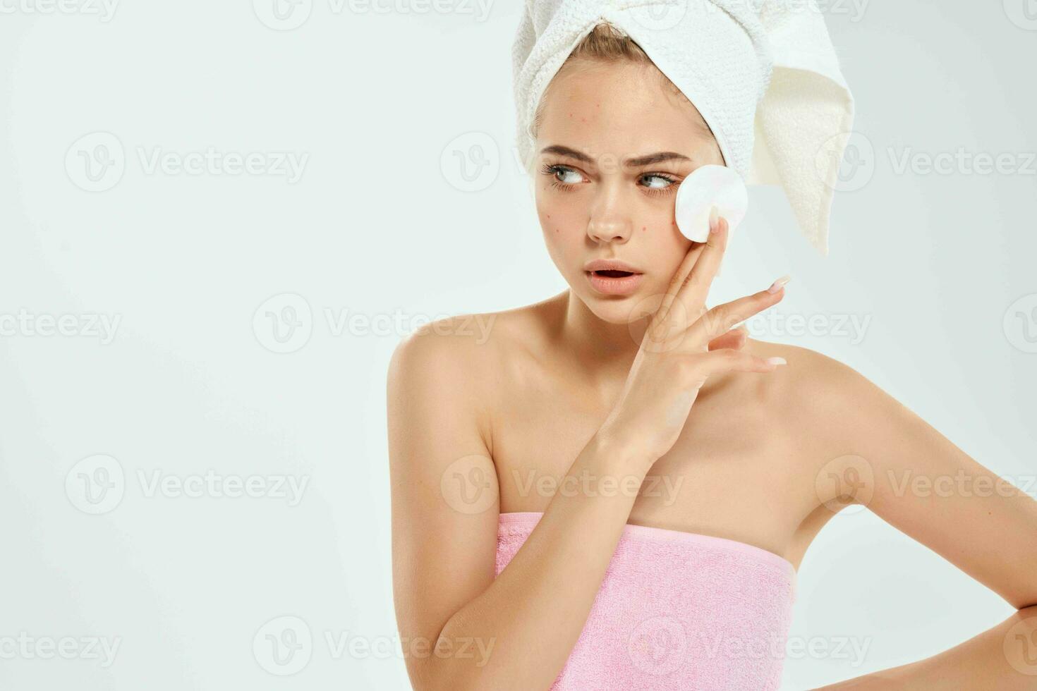woman with towel cleans skin with sponge health problems hygiene photo