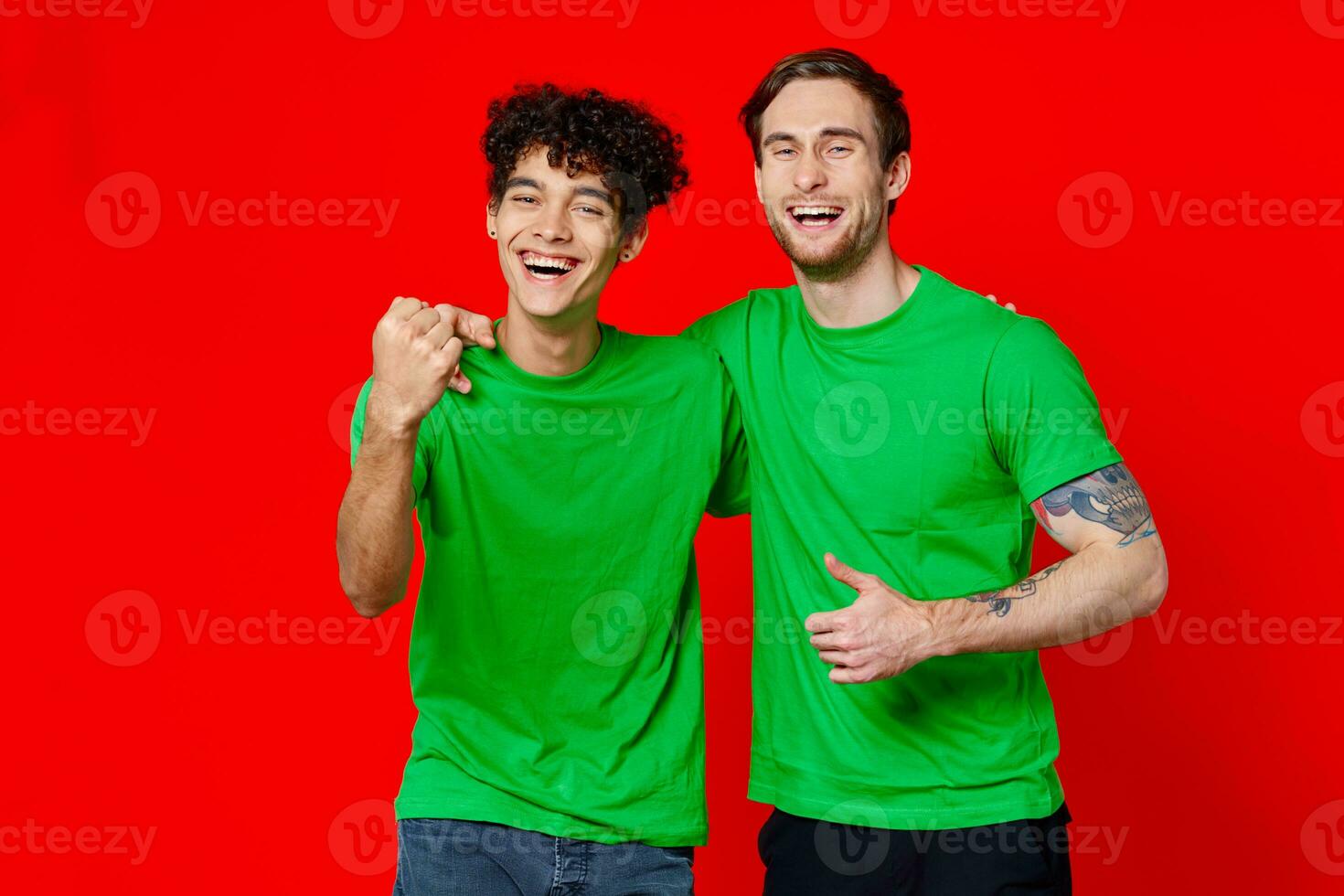 Cheerful friends green t-shirts emotions communication hug friendship photo