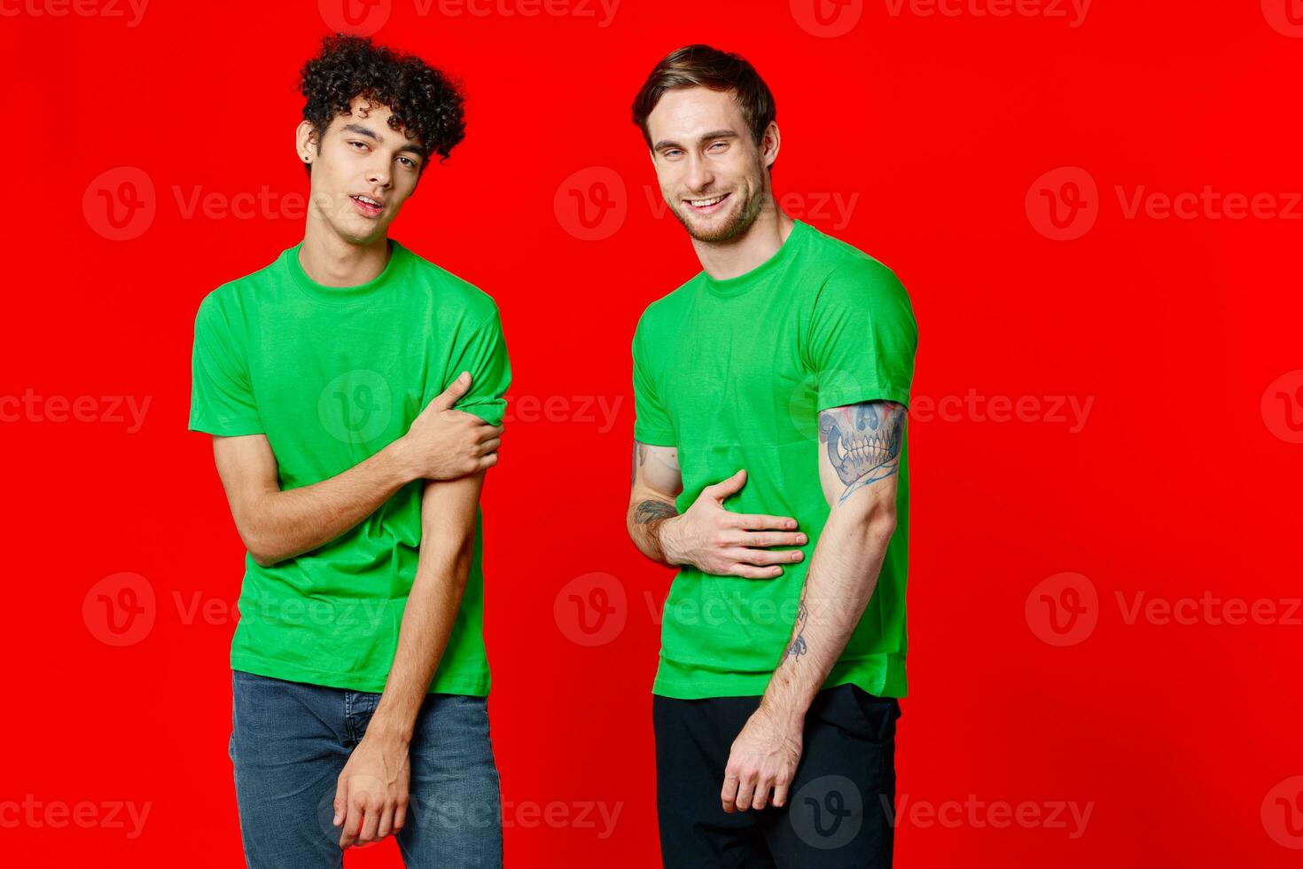 Cheerful friends in green t-shirts communication emotions isolated background photo