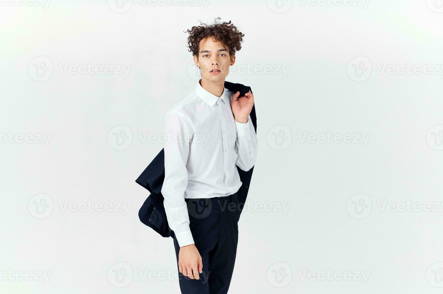 Cheerful man with curly hair in a business suit fashion modern style photo