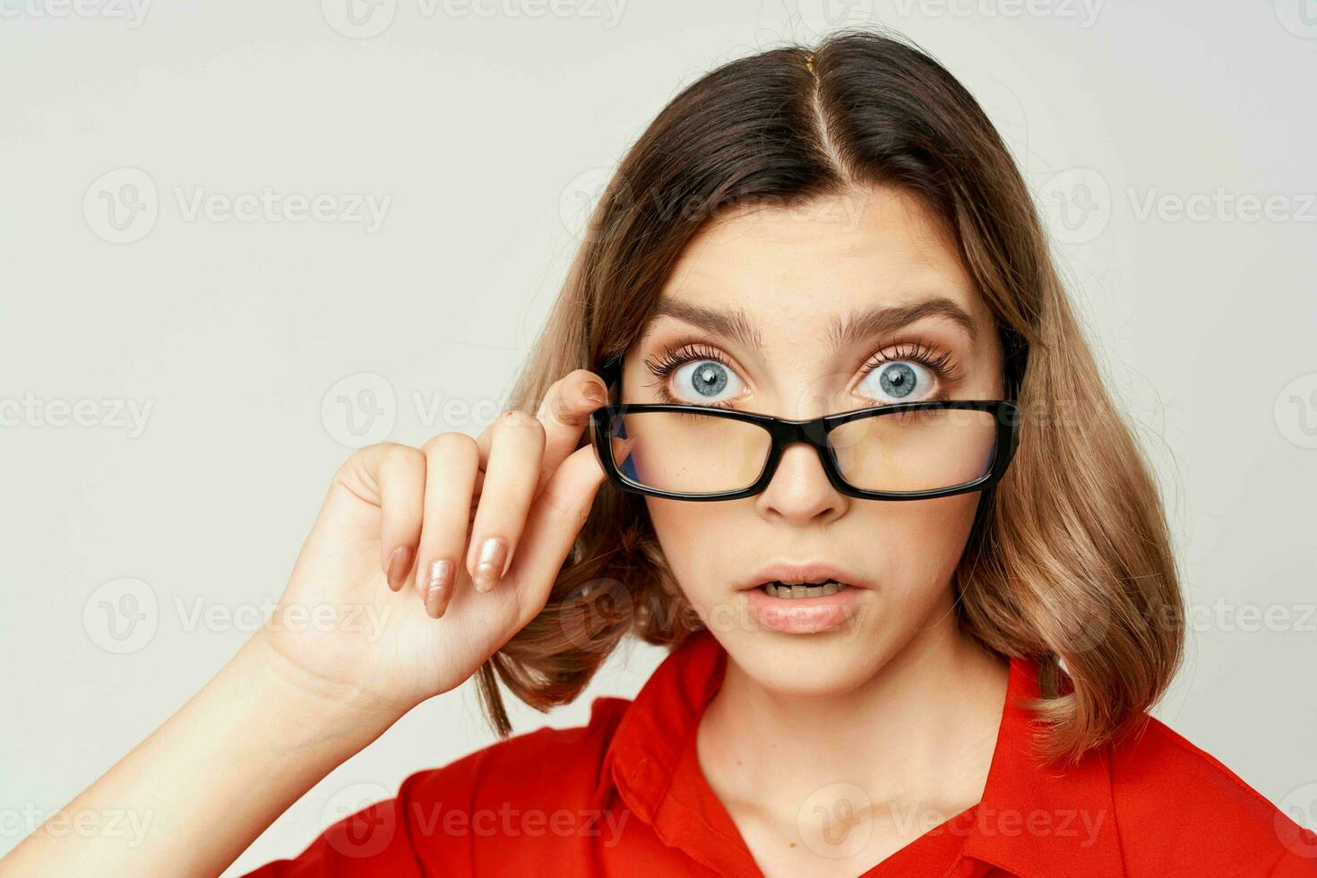 woman in red shirt wearing glasses emotions official office photo