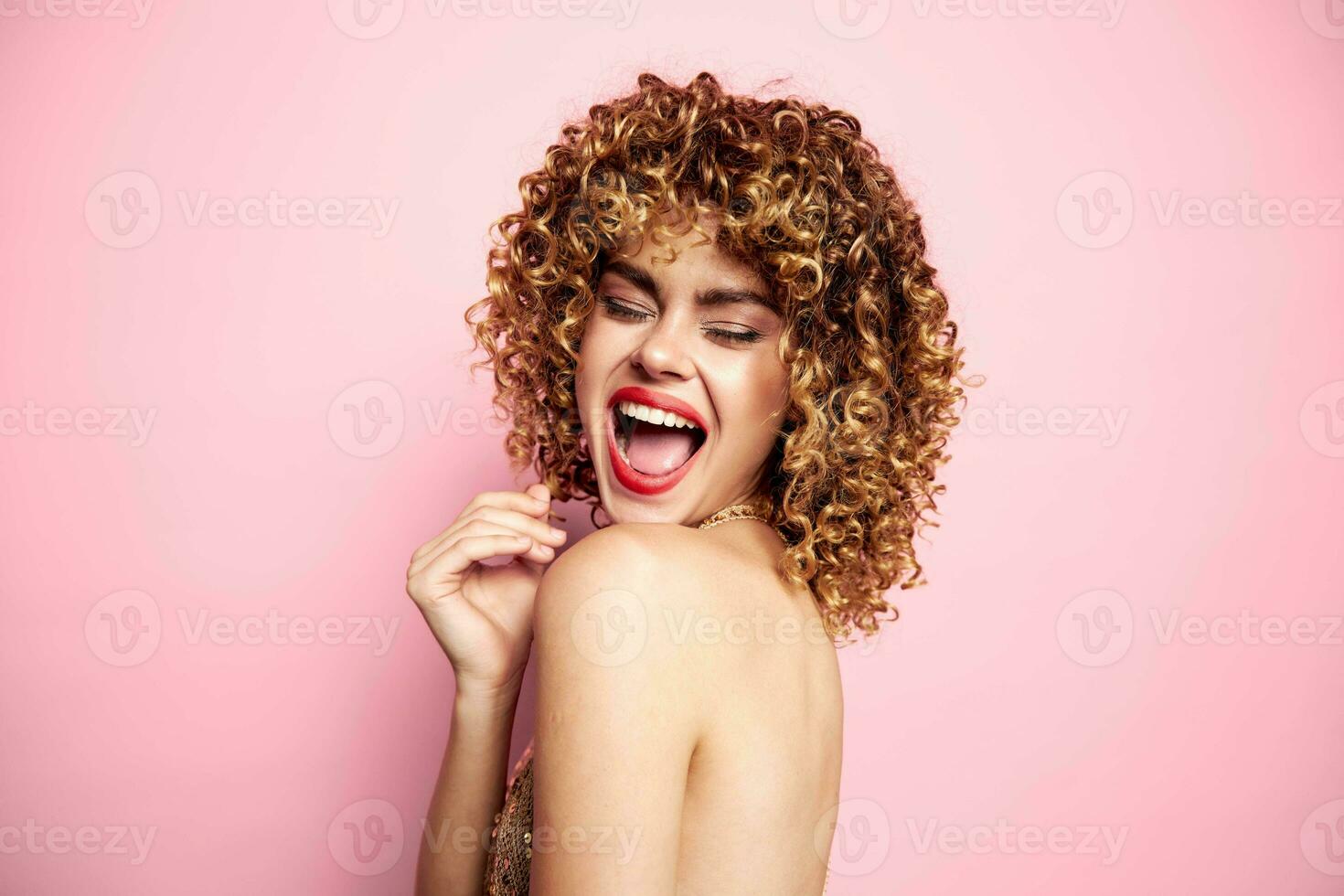 Charming model Curly hair bright makeup closed eyes fashionable clothes photo