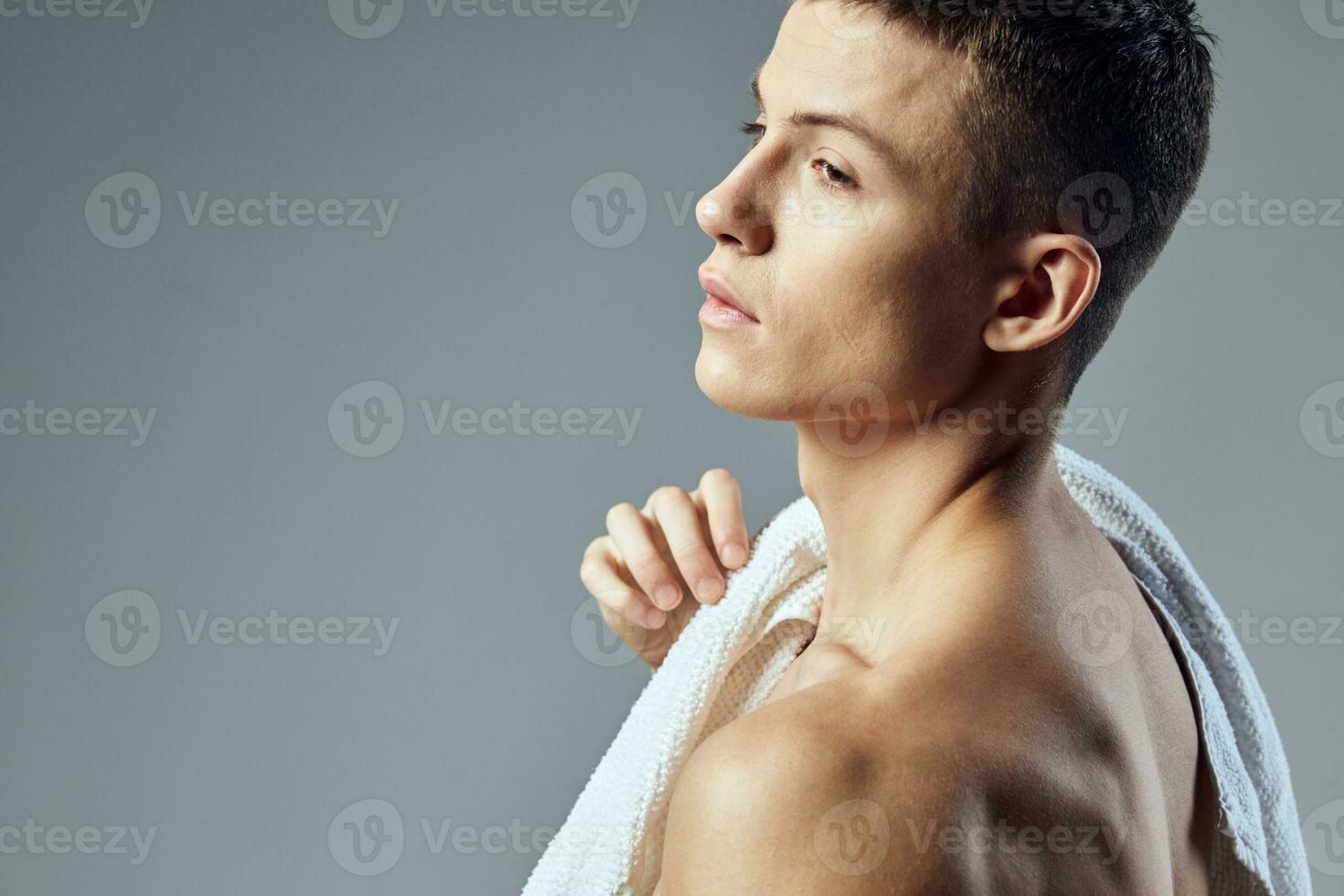 handsome man cropped view of towel on shoulders fitness workout close-up photo