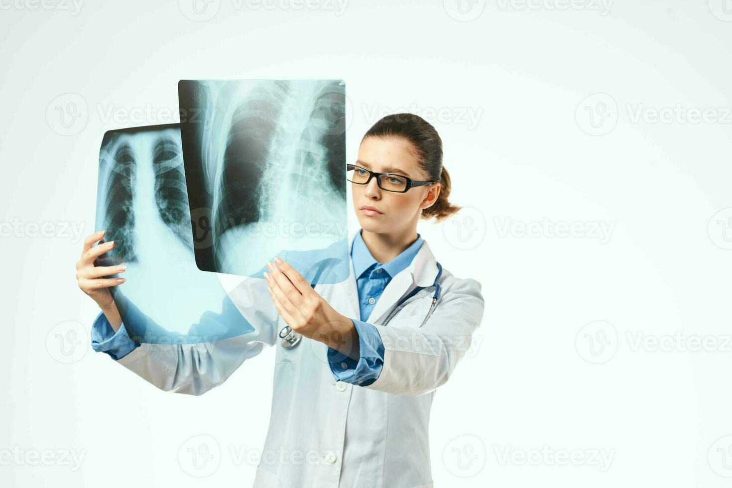 woman doctor radiologist x-rays examination hospital light background photo