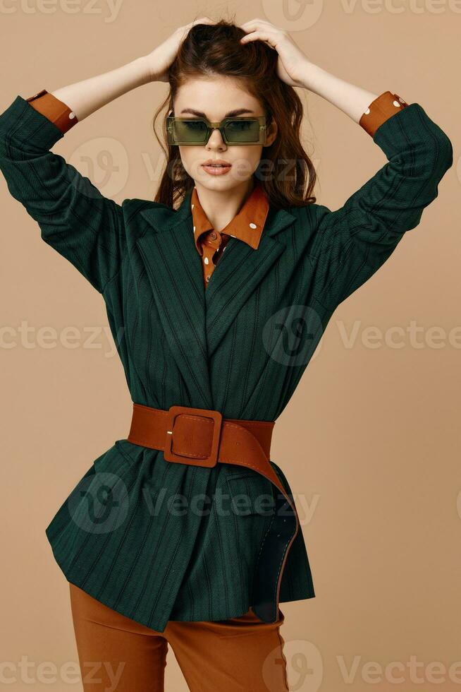 woman wearing sunglasses suit beige background model photo