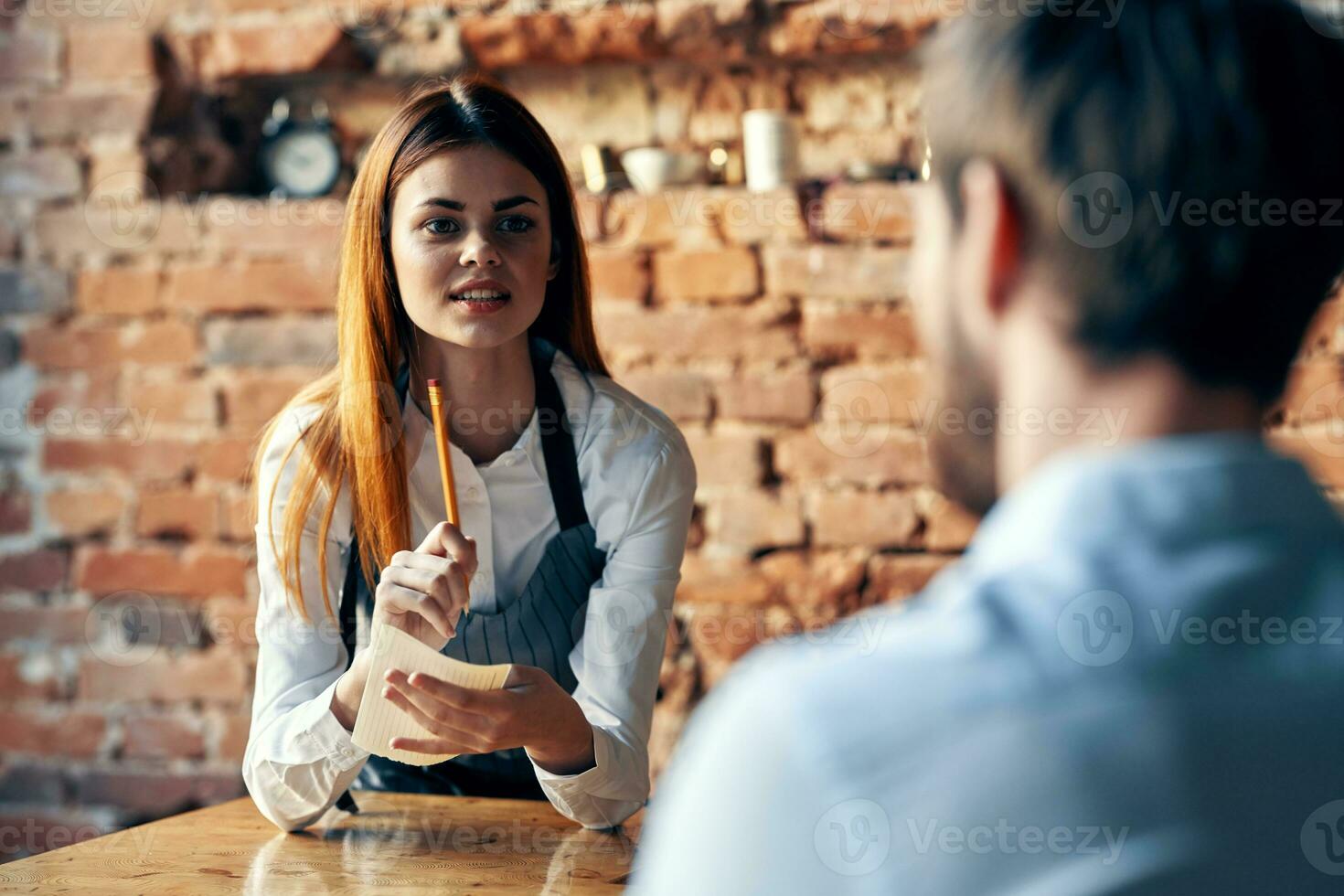 the waiter takes the order from the client communication professional lifestyle photo