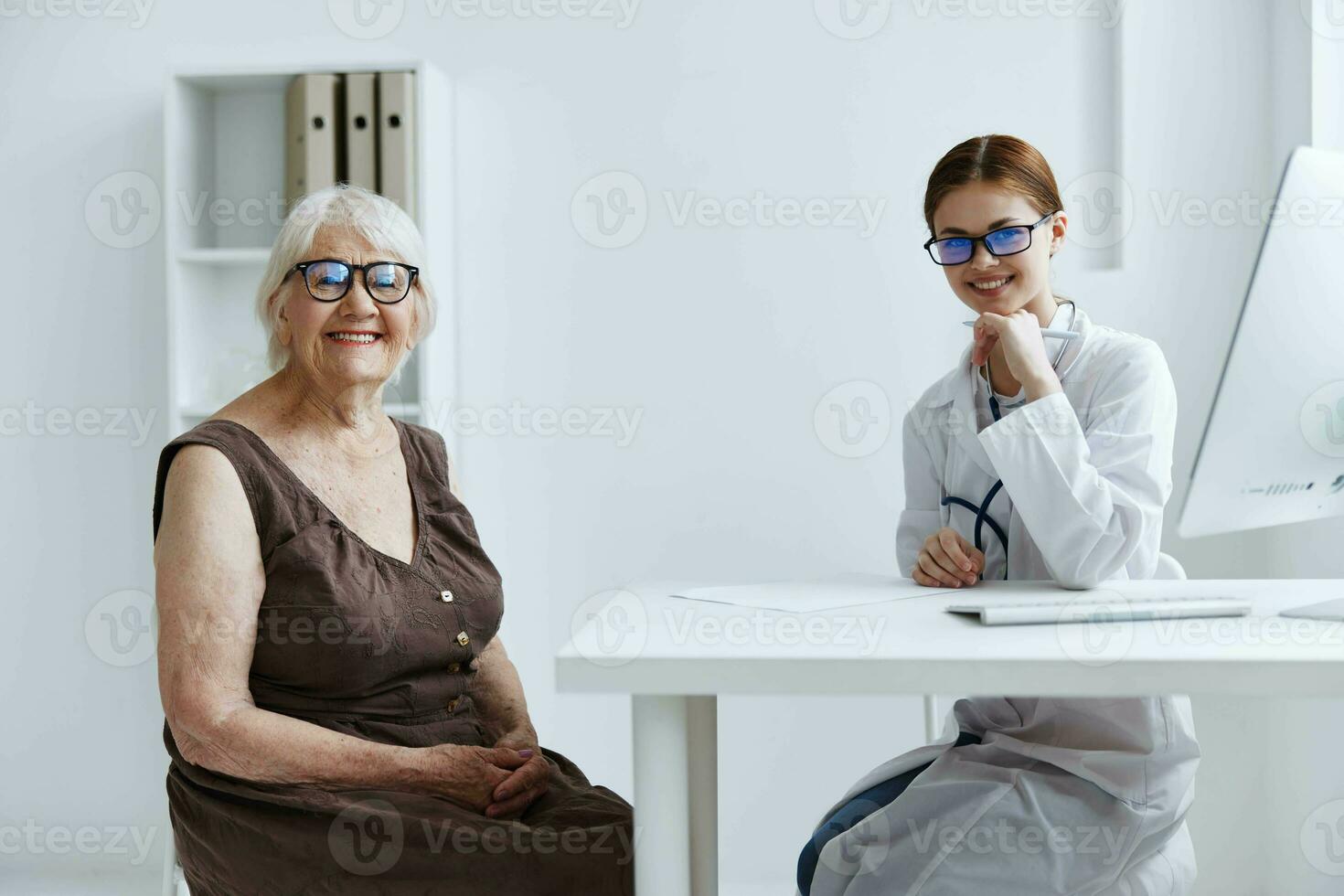 elderly woman consults with a doctor doctor assistant photo