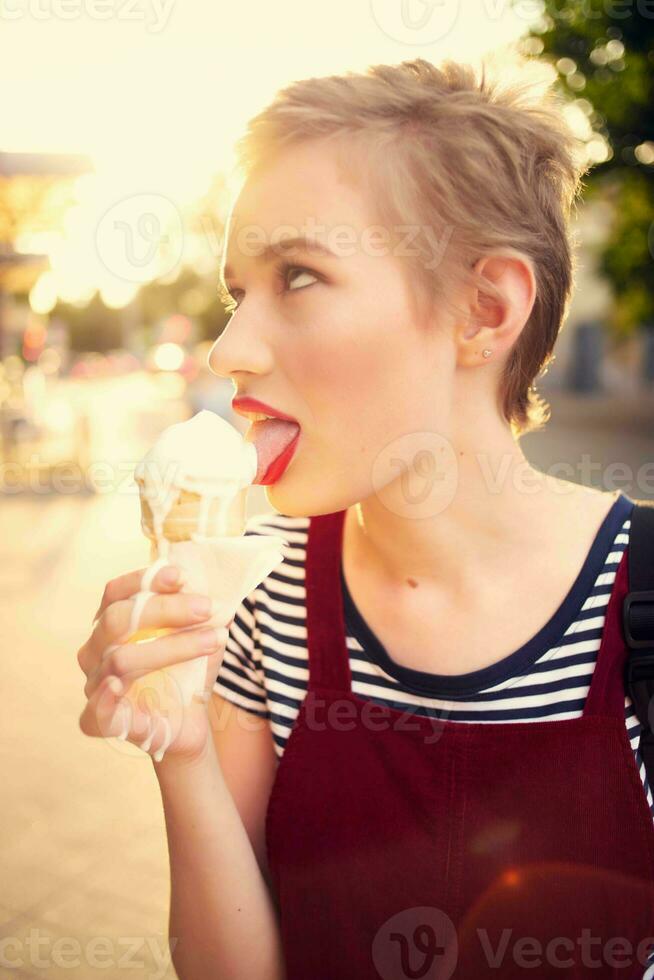 woman with short haired ice cream on the street in summer photo