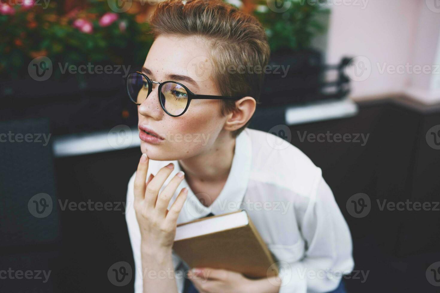 short haired woman with a book in his hands reading Lifestyle photo