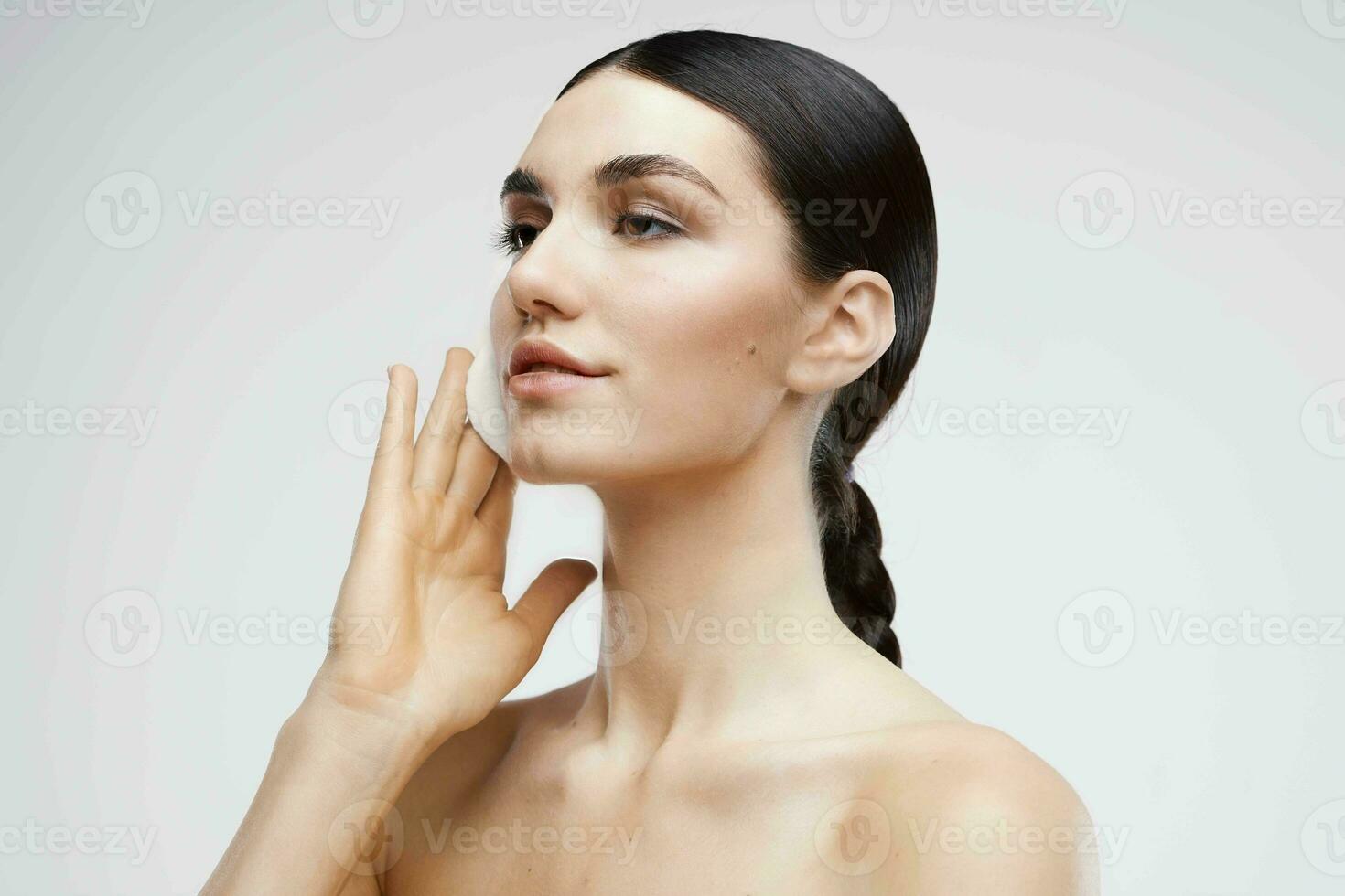 woman with nude disconnectable cream skin care close-up photo