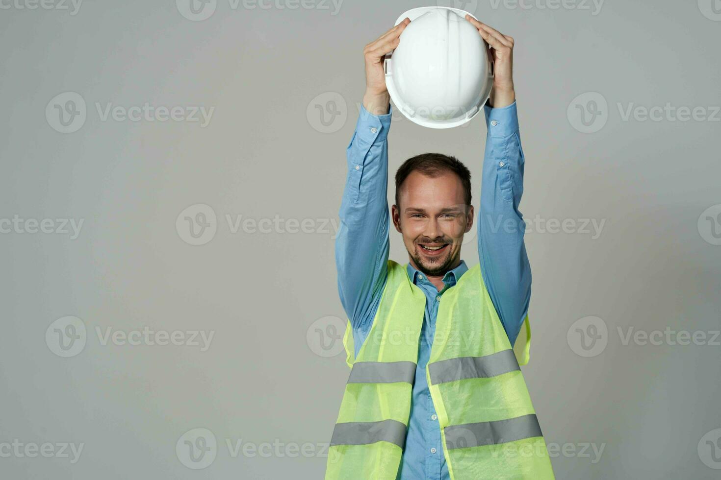 man reflective vest protection Working profession light background photo