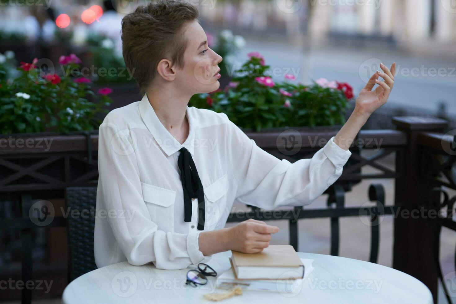 female in a summer cafe reading walk in the fresh air education photo
