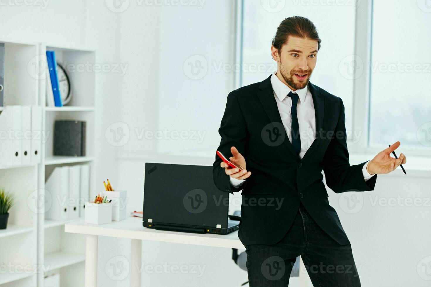 manager holding a phone telephone office lifestyle photo