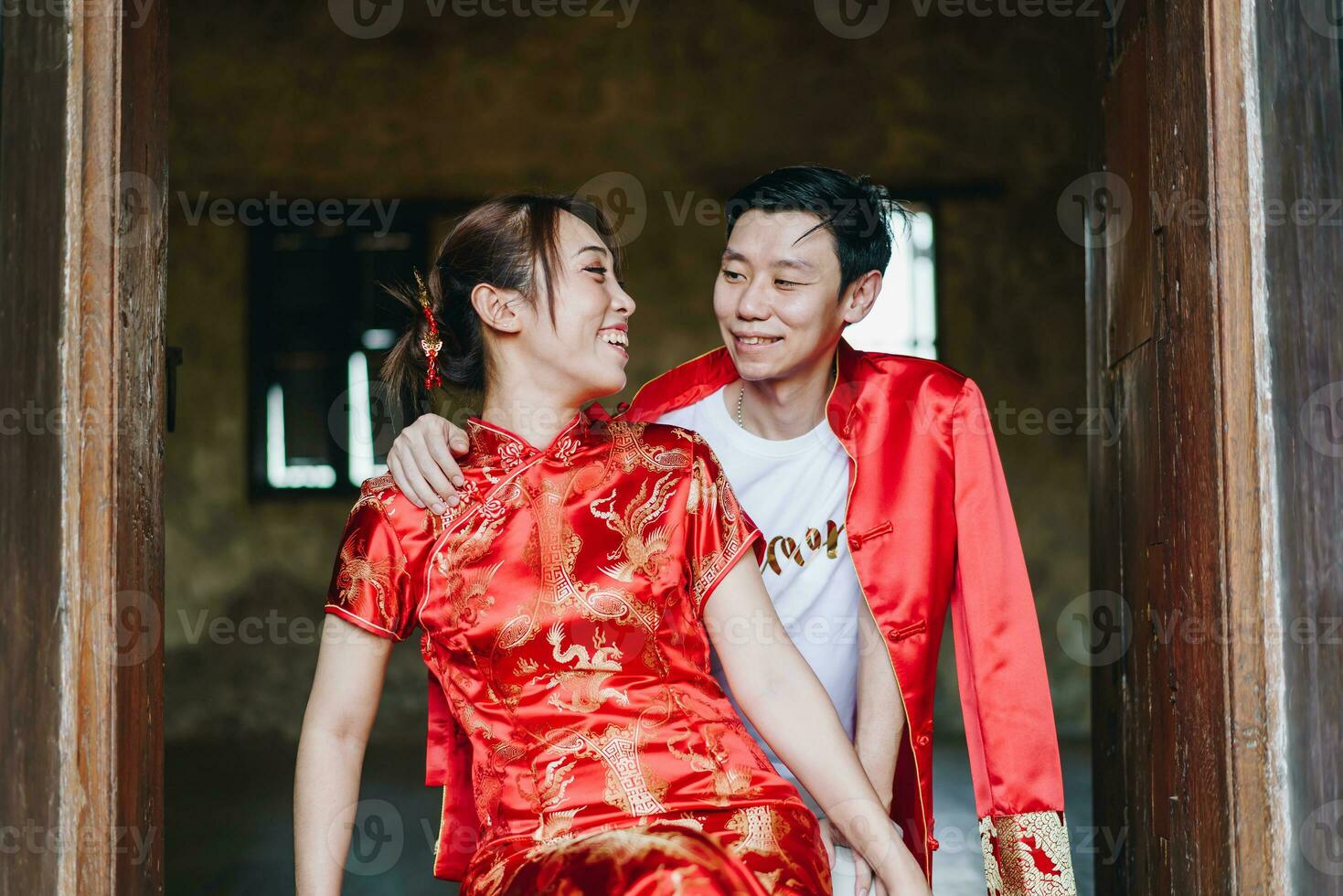 Happy young Asian couple in Chinese traditional dresses photo