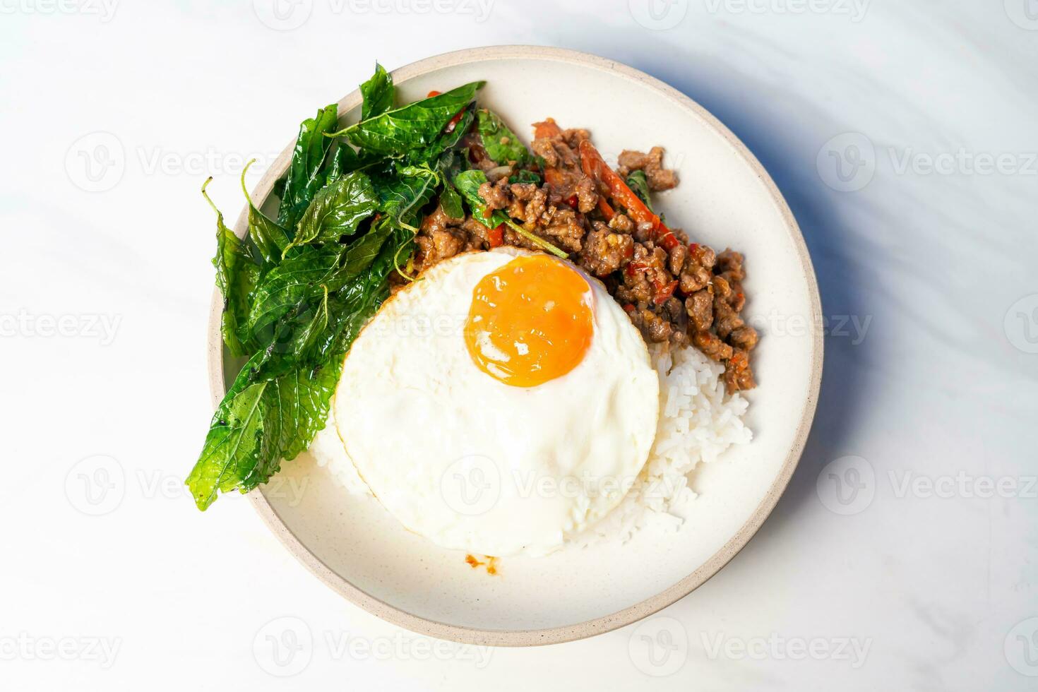 Stir fried Thai basil with wagyu beef and fried egg photo