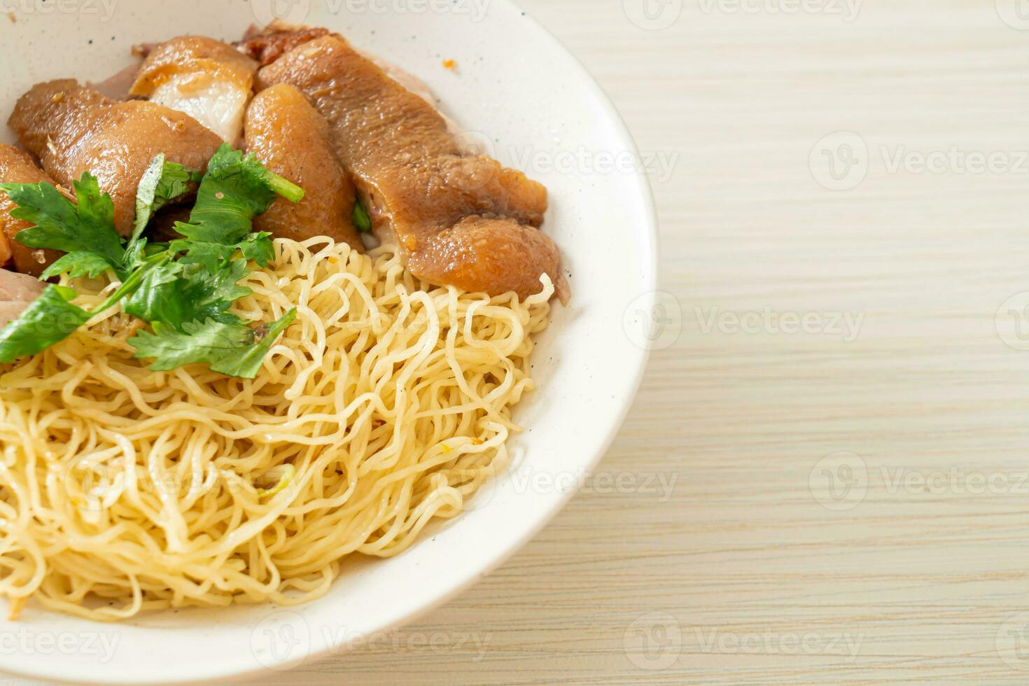 dried stewed pork leg noodles bowl photo