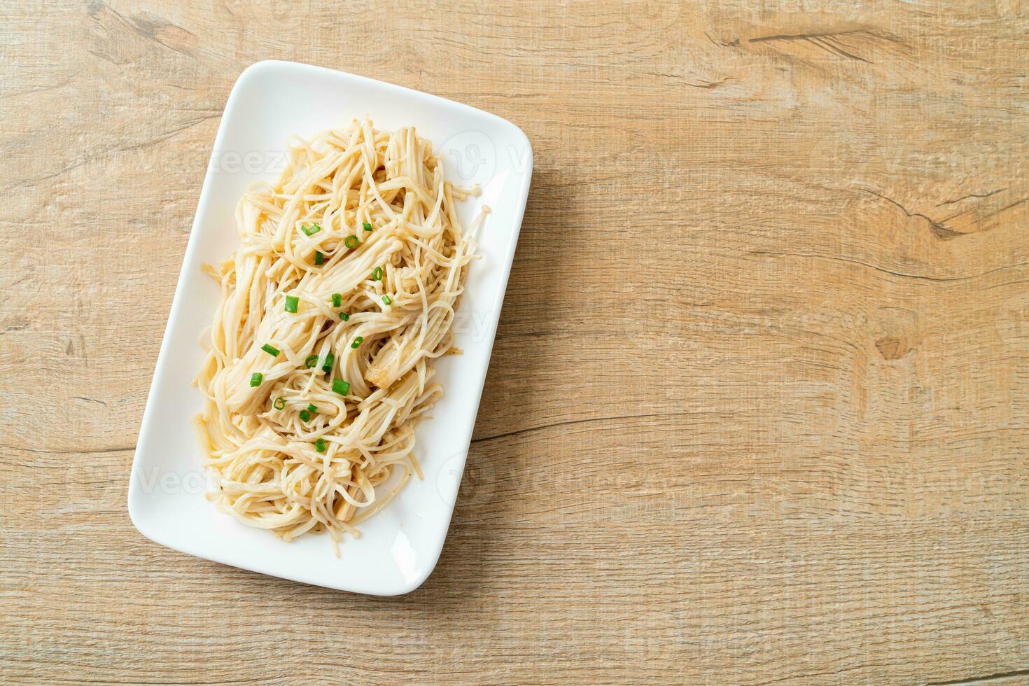 stir-fried golden needle mushroom with butter photo