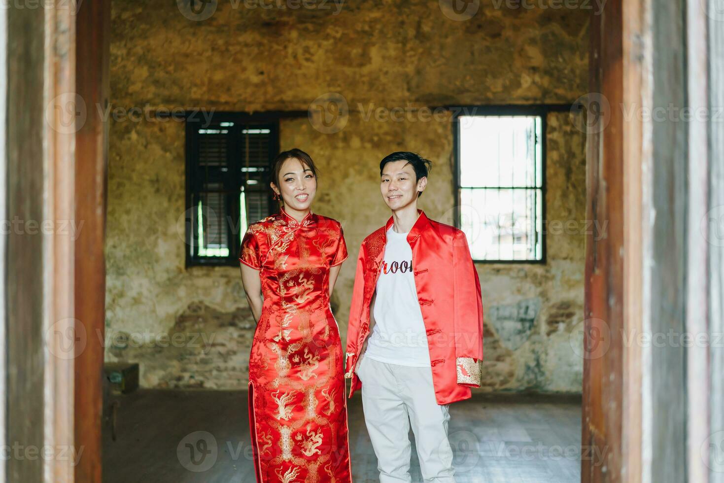 Happy young Asian couple in Chinese traditional dresses photo