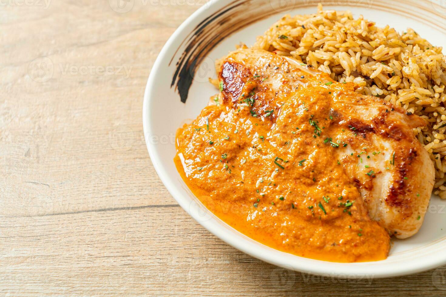 grilled chicken steak with red curry sauce and rice photo