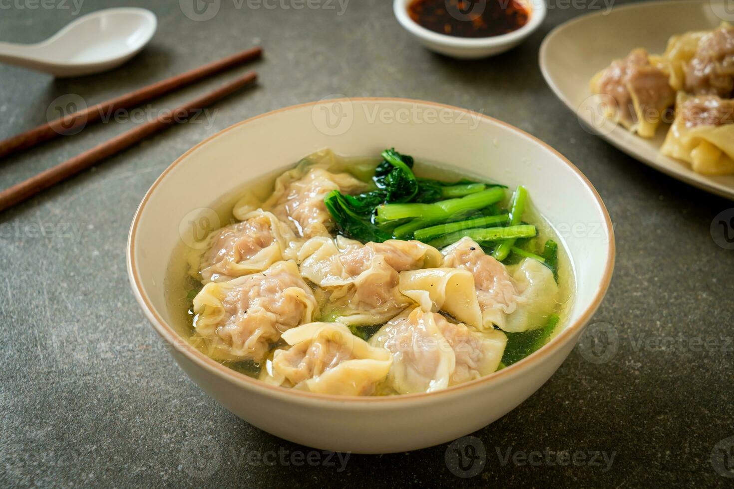 pork wonton soup or pork dumplings soup with vegetable photo