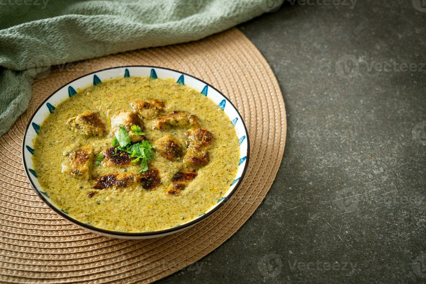 Afghani chicken in green curry or Hariyali tikka chicken hara masala photo