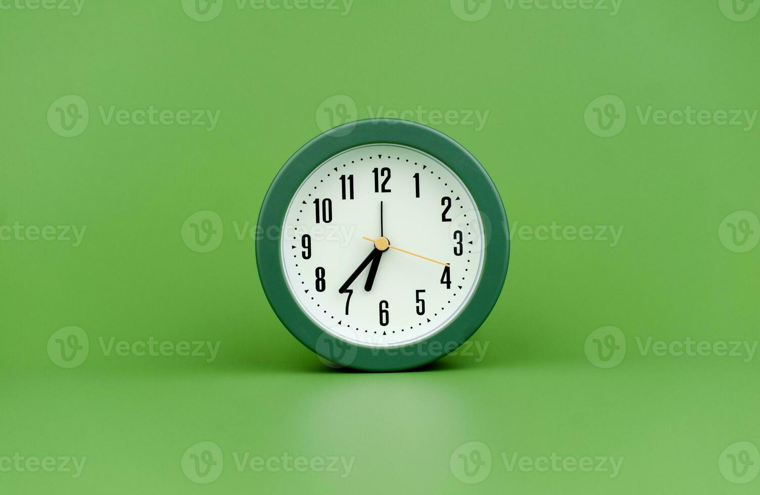 clock precious time alarm clock on green background concept of time working with time photo