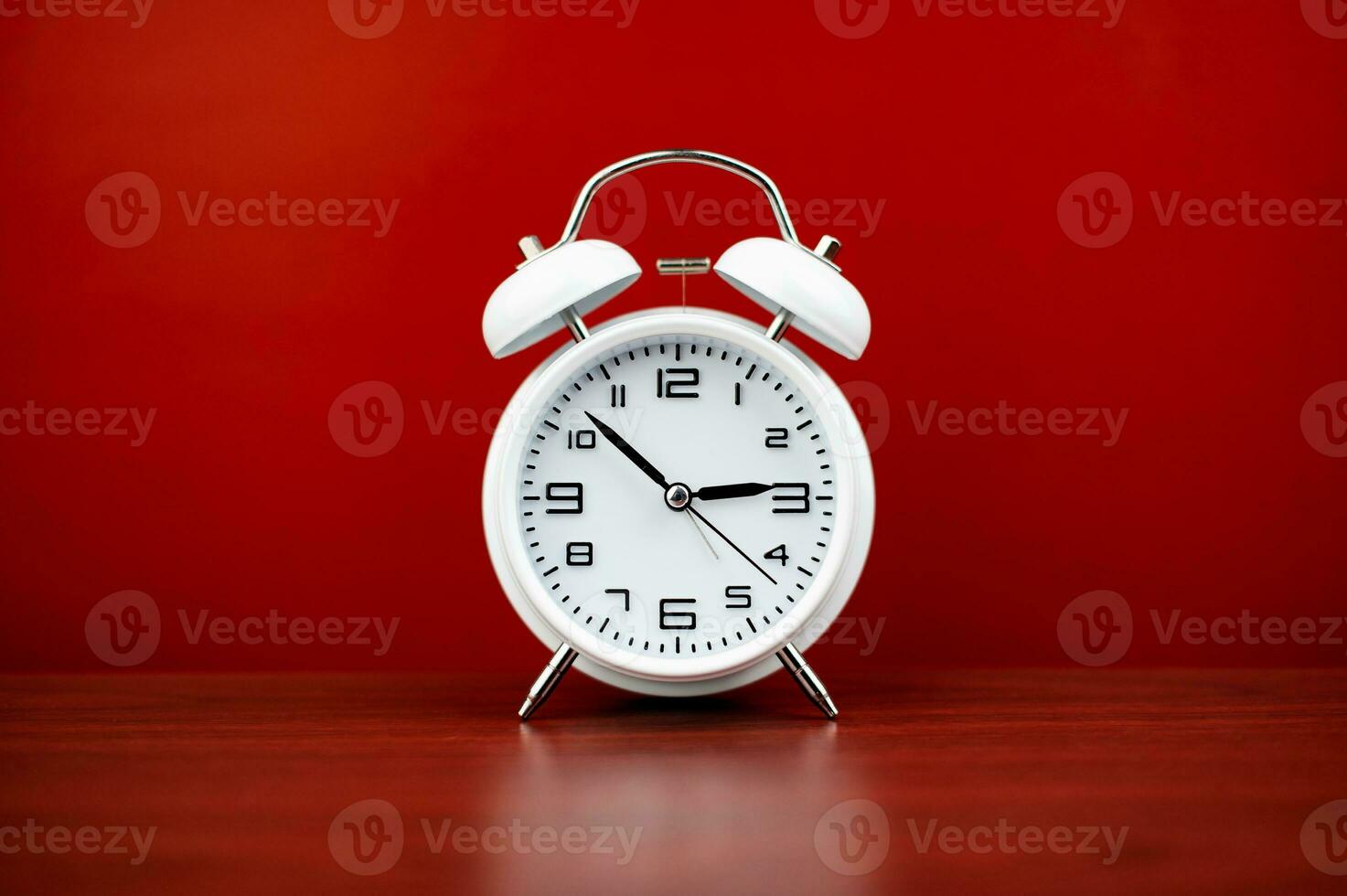 clock precious time alarm clock on red background concept of time working with time photo