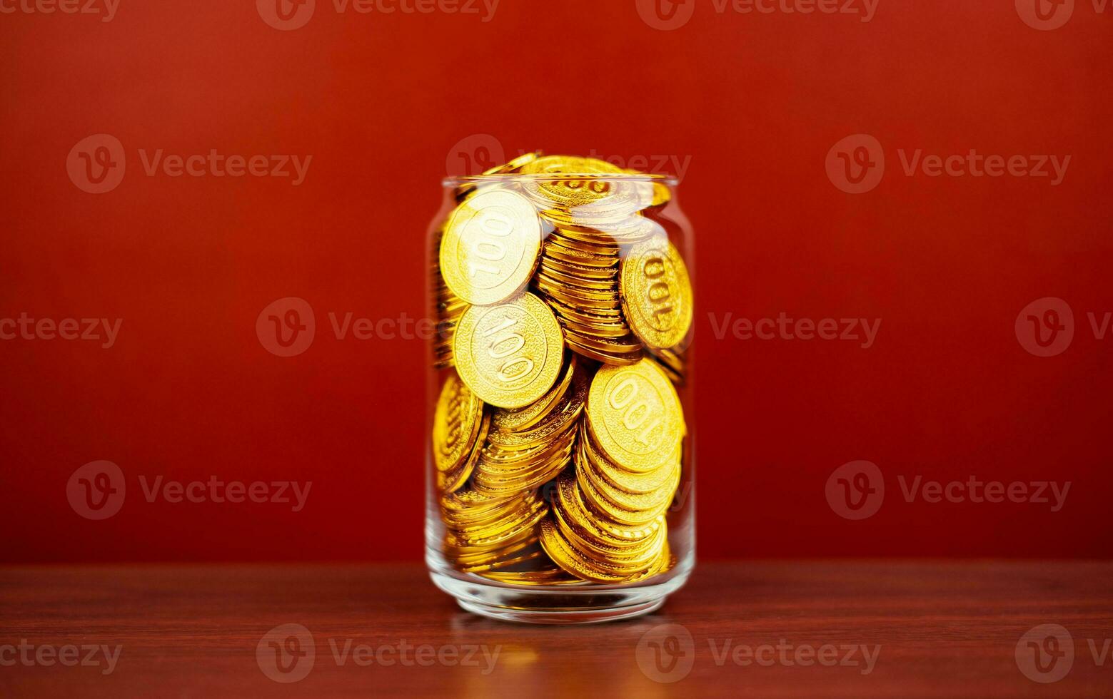 gold coins in a glass jar saving money coin coin bank income wages expenditure money financial stability photo