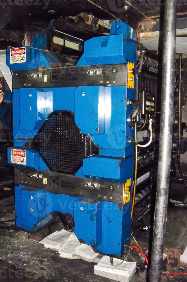 machines on a large printing plant factory, printing of books photo
