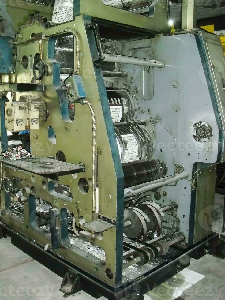 machines on a large printing plant factory, printing of books photo