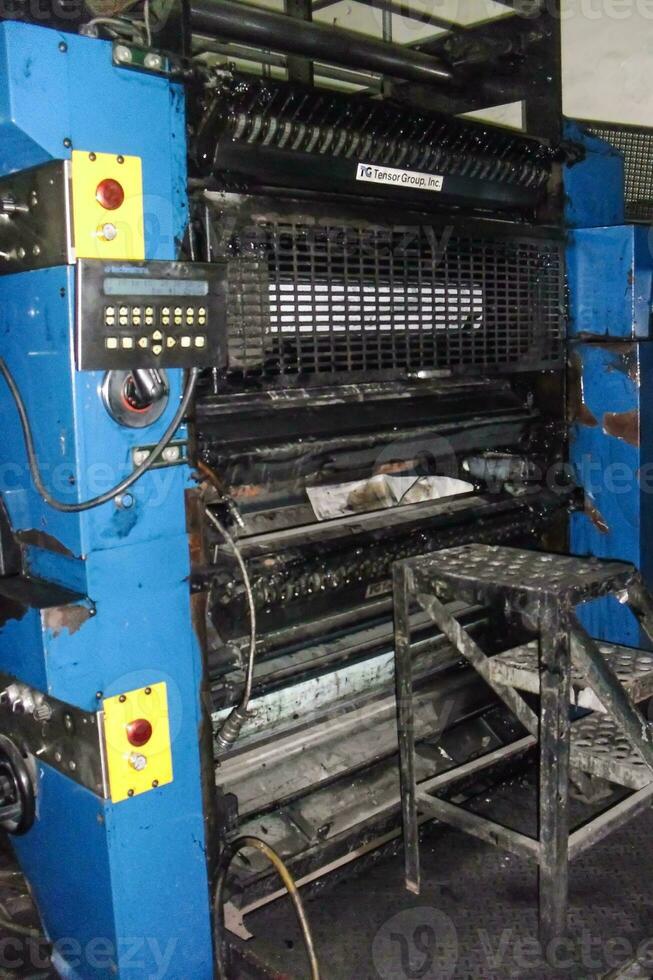 machines on a large printing plant factory, printing of books photo