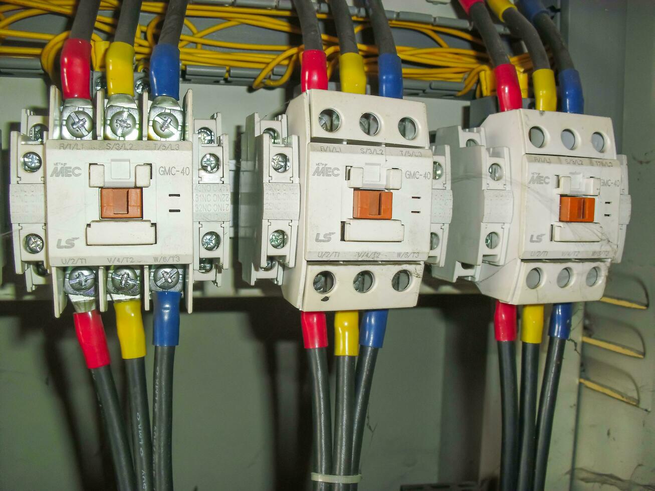 Voltage switchboard panel, electrical components at plant and factory with circuit breakers. photo