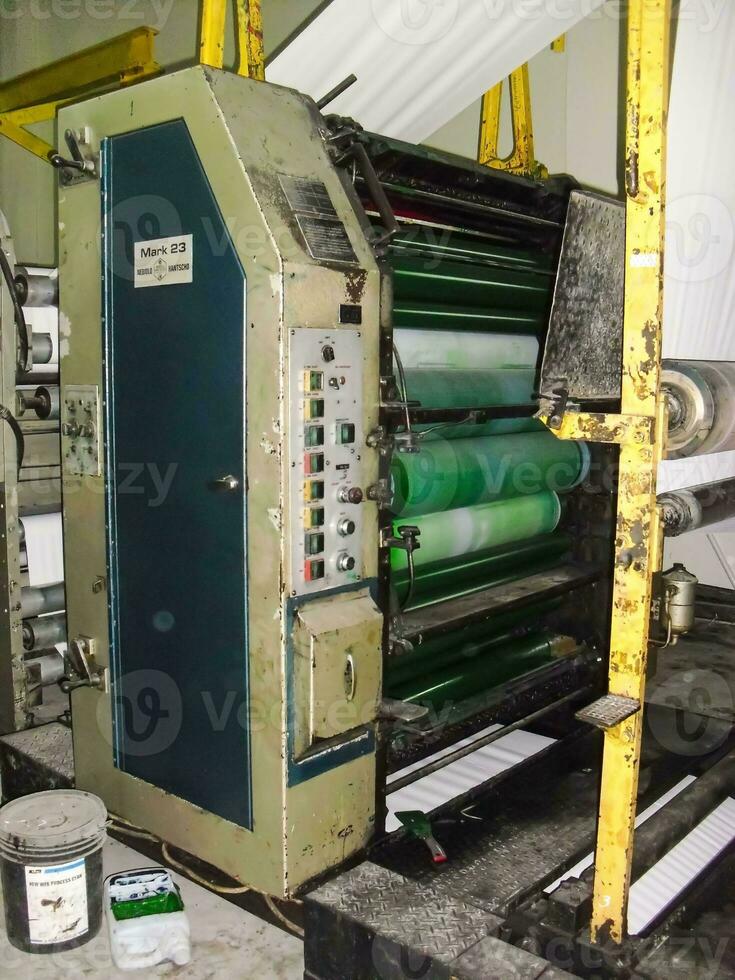 machines on a large printing plant factory, printing of books photo
