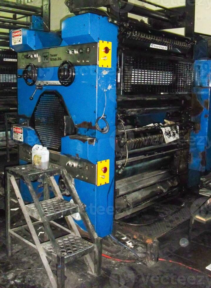 machines on a large printing plant factory, printing of books photo