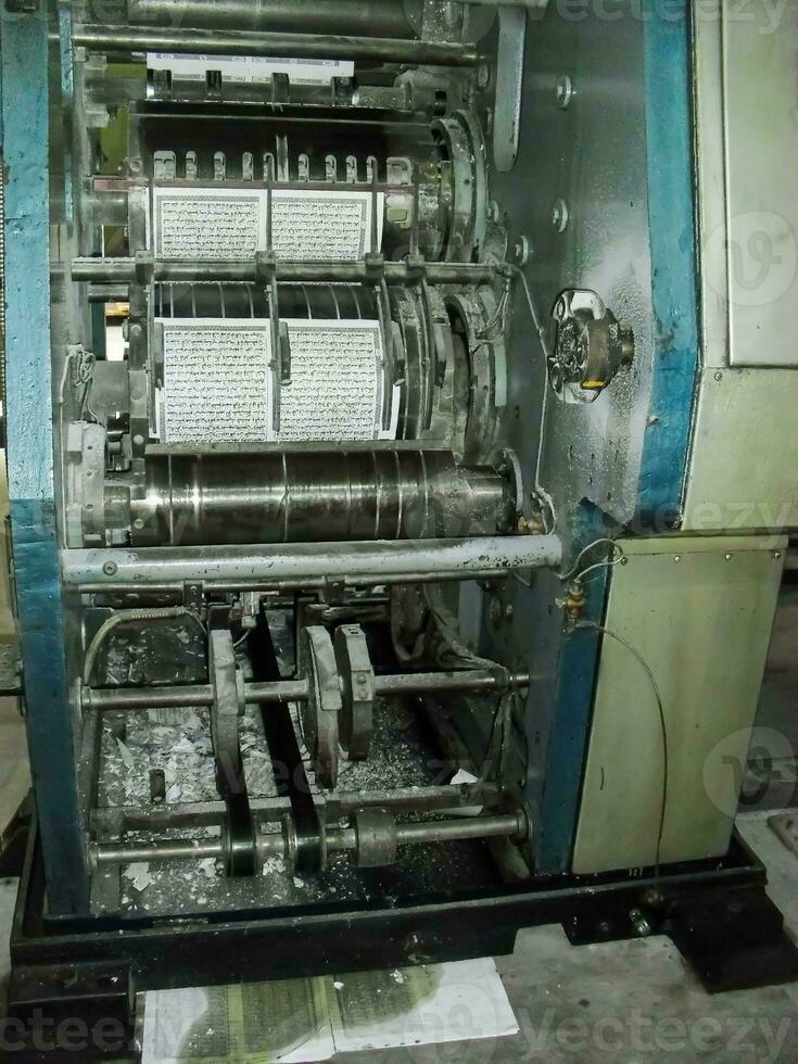 machines on a large printing plant factory, printing of books photo
