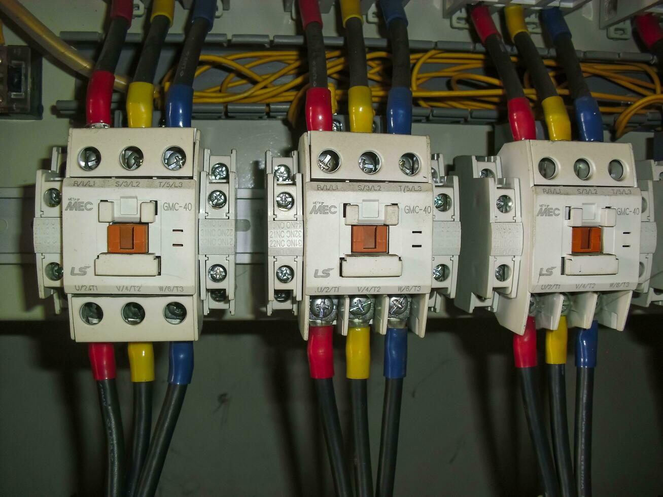Voltage switchboard panel, electrical components at plant and factory with circuit breakers. photo