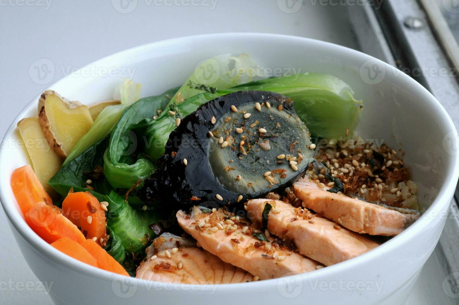 Japanese salmon with mixed salad on rice photo