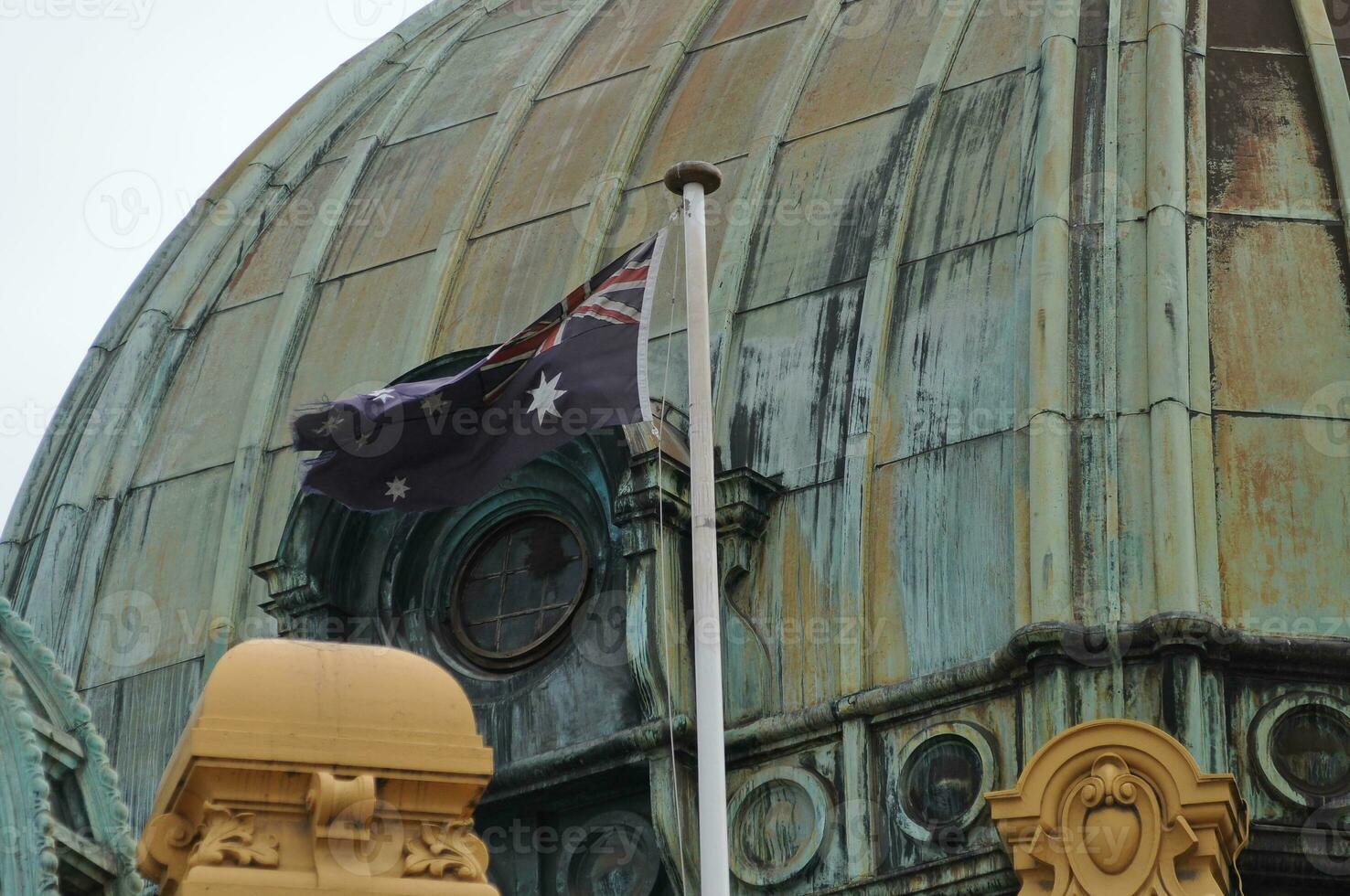 Australian national flag flying on a big dome photo