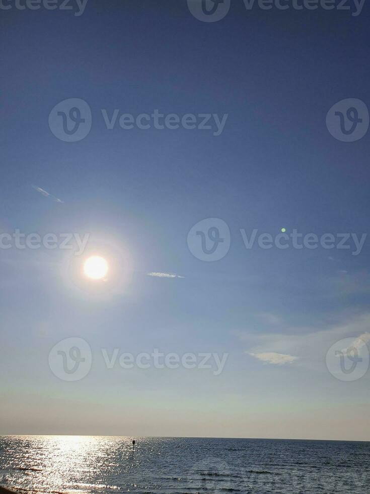 The sun is dim in the afternoon over the Java Sea photo