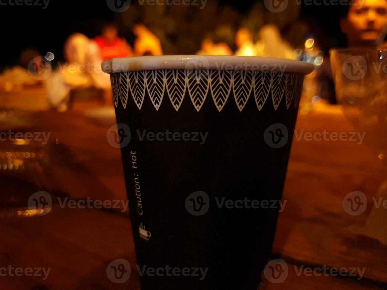 A cup of delicious black coffee that is delicious to enjoy at night photo