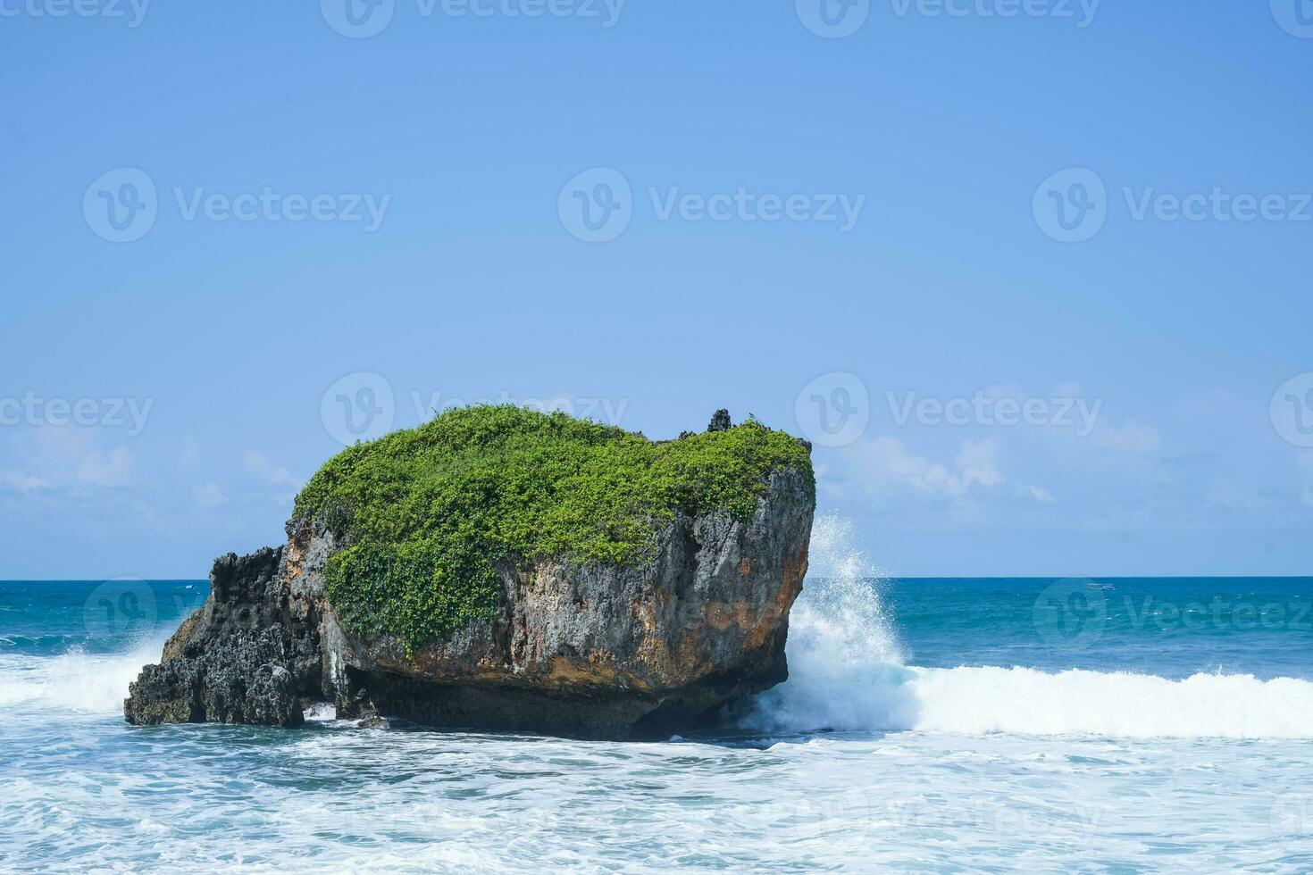 waves splashing on the rocks by the sea, in mesra beach photo